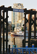 view from Granville Island through ferry dock to West End in Vancouver, BC